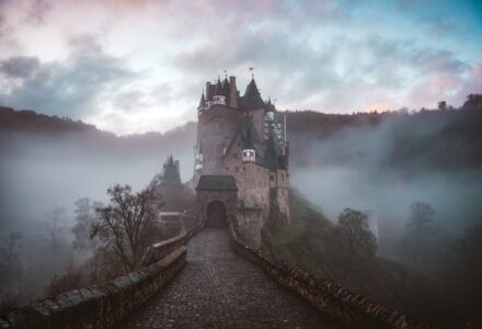 Fog-shrouded historic castle illustrating Gothic fiction, mystery and the supernatural