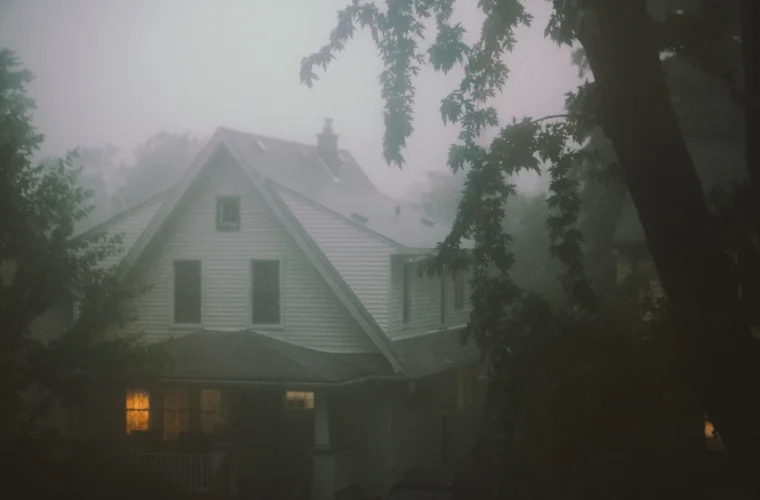House surrounded by fog and trees evoking Cosmic Gothic atmosphere