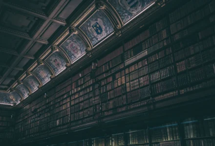 Dark historic library evoking forbidden knowledge and eldritch horror