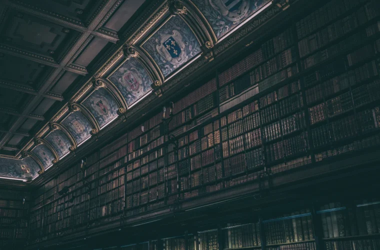 Dark historic library evoking forbidden knowledge and eldritch horror